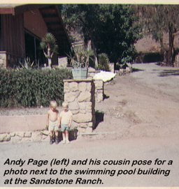 Andy Page (left) and his cousin pose for a photo next to the swimming pool building at the Sandstone Ranch