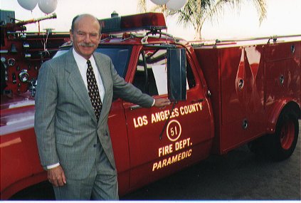 Jim Page posed for a photo with Squad 51 at the dedication of the new Fire Station 51 at Universal Studio in 1995.